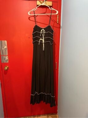Black dress with white trim and bows